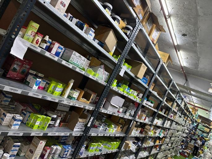 Shelving stocked with pharmaceutical products