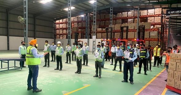 Morning safety briefing on the warehouse floor